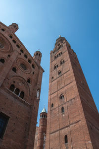 Low angle view of historic building against clear blue sky