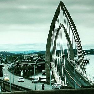 Bridge against sky in city