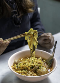 Midsection of woman having food