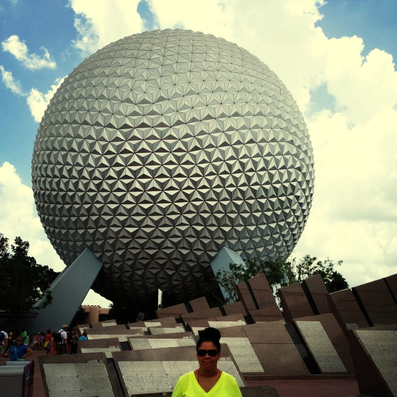 leisure activity, lifestyles, sky, built structure, architecture, building exterior, low angle view, cloud - sky, standing, men, modern, city, person, casual clothing, tourism, rear view, famous place, arts culture and entertainment