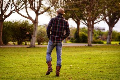 Rear view of man standing on field