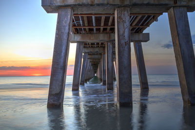 Scenic view of pier over sea against sky