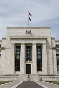 Flag on built structure against sky