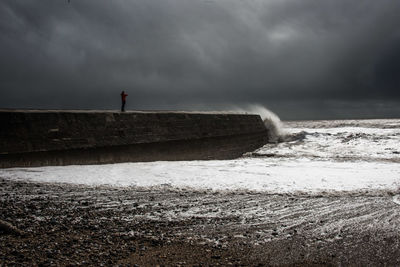 Scenic view of sea against cloudy sky