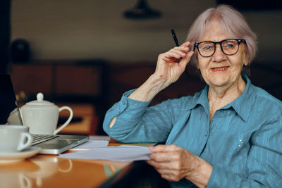 Senior woman sitting in cafe