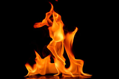 Red fire against black background