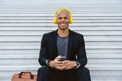 Portrait of young man using mobile phone