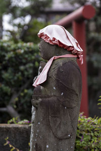 Close-up of sculpture on wooden post