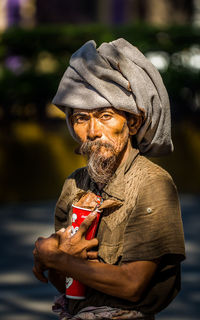 Man holding umbrella