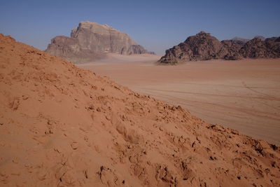 Scenic view of desert against clear sky