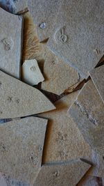 High angle view of stones on sand