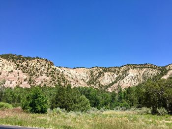 Scenic view of landscape against clear blue sky