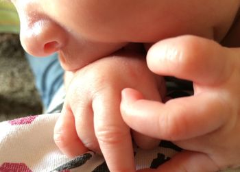 Midsection of mother and baby