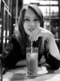 Young woman drinking glass