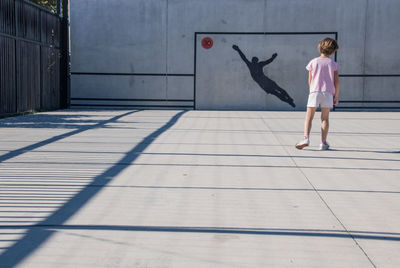 Full length of woman standing on playground