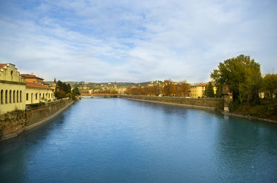 View of river in city against sky