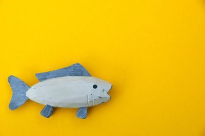 Close-up of toy against yellow background