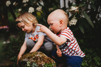 High angle view of mother and girl with plants