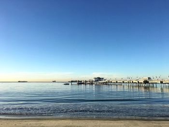 Scenic view of sea against clear blue sky