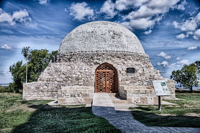 View of historical building against cloudy sky