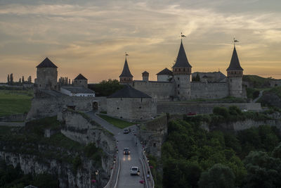 Panoramic view of historic building against sky during sunset