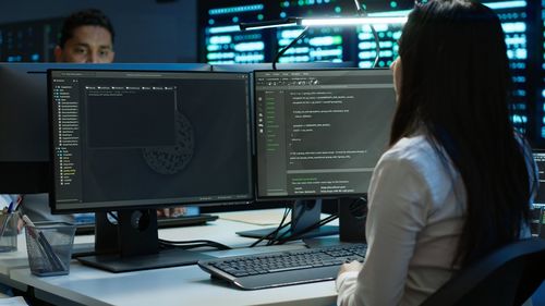 Businesswoman using laptop at office