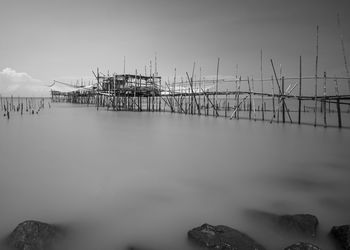 Pier over sea against sky