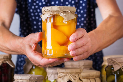 Close-up of hand holding drink