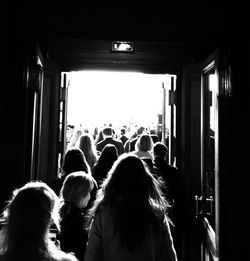Rear view of people at doorway during music concert
