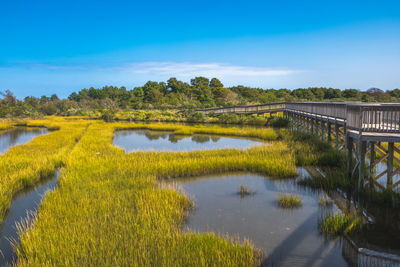 Bridge over lake against sky