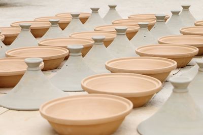 Row of tea cups on table