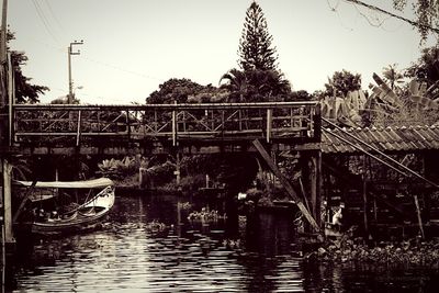 Bridge over river against clear sky