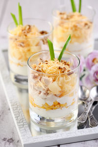Chicken salad with pineapple, corn, seasoned with greek yogurt, crushed nuts and grated cheese.  