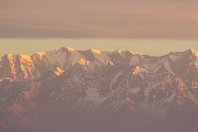 Scenic view of snowcapped mountains against sky during winter