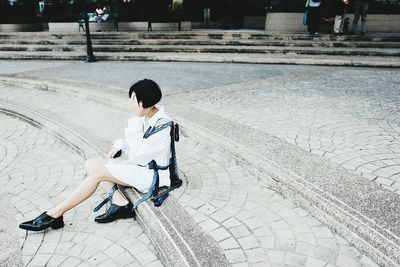 Full length of boy sitting on floor