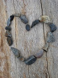 High angle view of heart shape on tree trunk