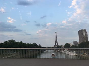 Bridge over river with buildings in background