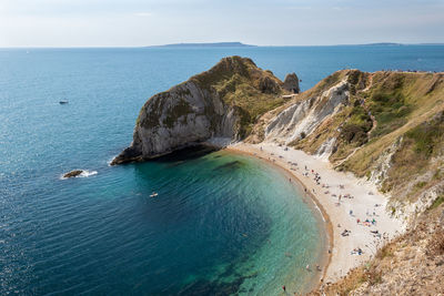 High angle view of sea shore against sky