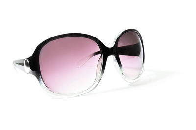 Close-up of sunglasses against white background