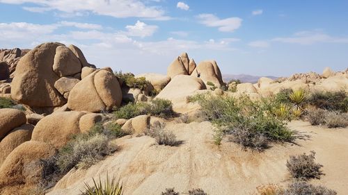 Rock formations on mountain against sky