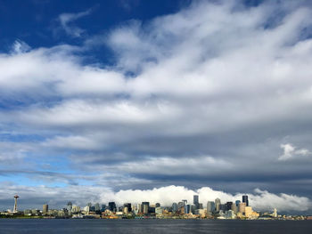 Seattle skyline and cloudscape. approaching the city from the bainbridge island to seattle.