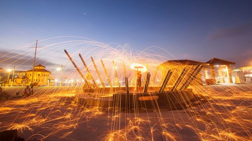 Sparks against sky at night