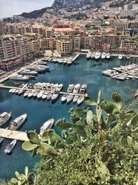 High angle view of sea and buildings in city