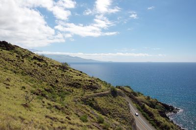 Scenic view of mountains and sea against sky