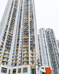 Low angle view of modern buildings against sky