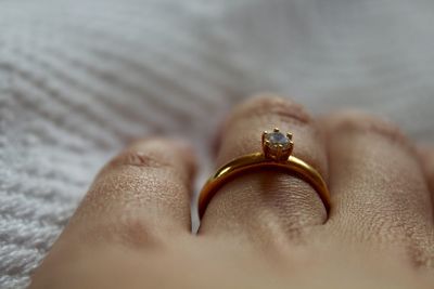 Close-up of hand with diamond ring