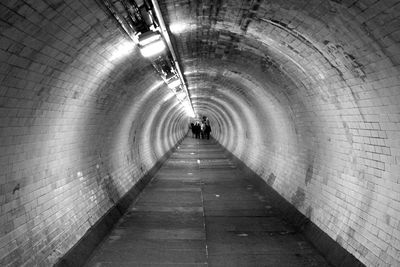 Man walking in subway tunnel