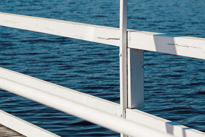 Close-up of sailboat sailing on sea