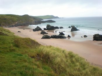 Scenic view of beach against sky