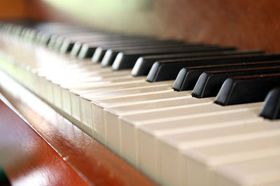 Piano keyboard close-up with bokeh effect